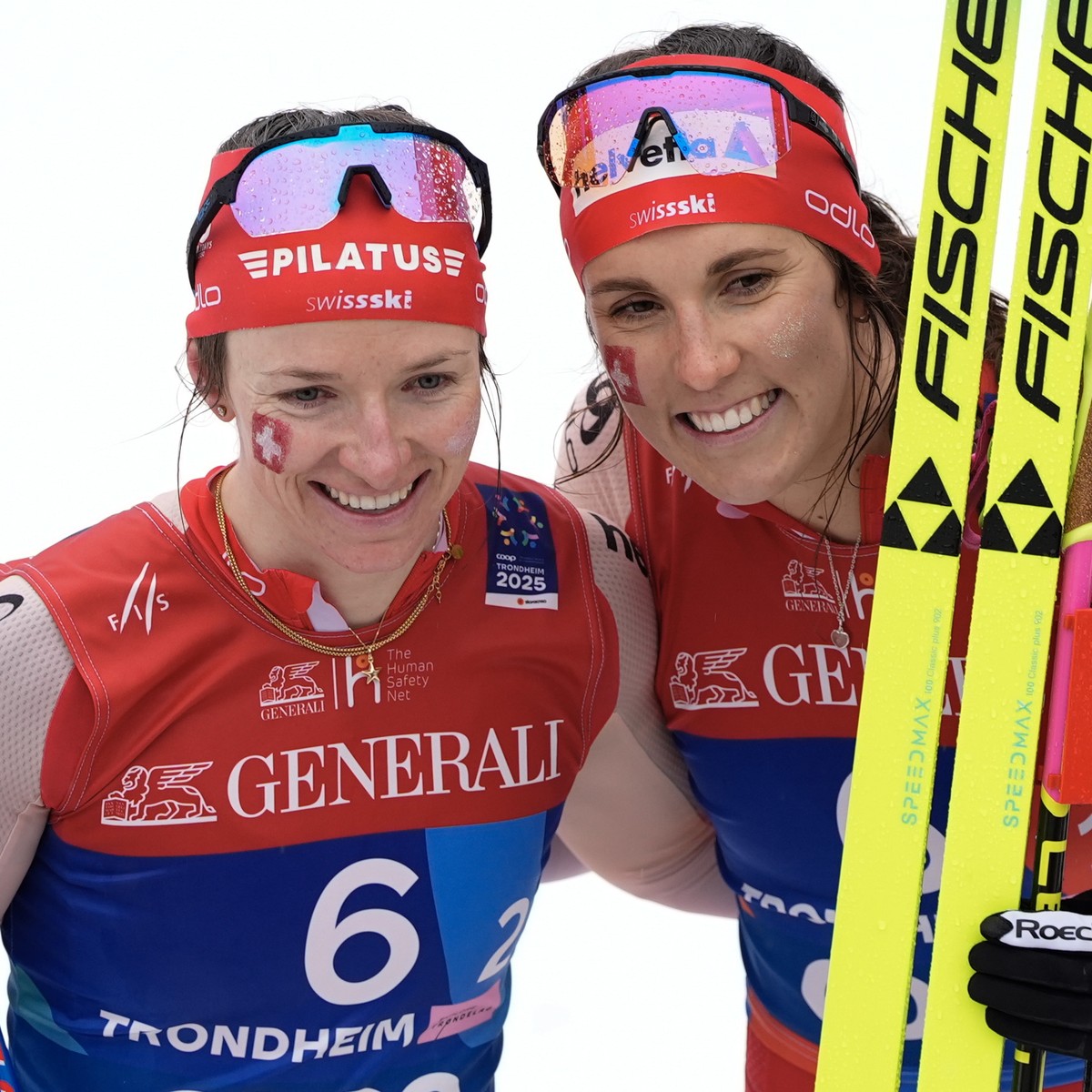 epa11942194 Nadine Faehndrich (L) and Anja Weber of Switzerland celelrate after winning bronze in the Team Women's Sprint Classic race at the FIS Nordic World Ski Championships in Trondheim, Norw ...