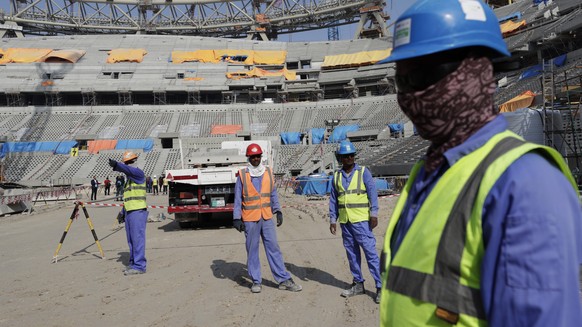 Workers work at Lusail Stadium, one of the 2022 World Cup stadiums, in Lusail, Qatar, Friday, Dec. 20, 2019. Construction is underway to complete Lusail&#039;s 80,000-seat venue for the opening game a ...