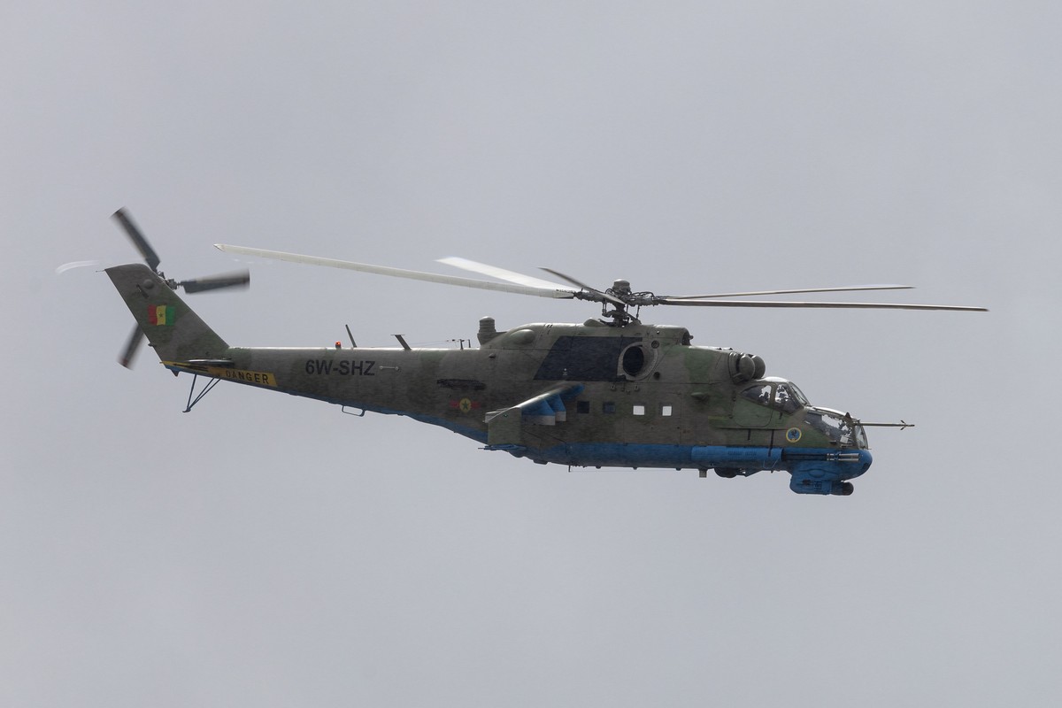 epa11454608 A Mil Mi-24 attack helicopter of the Senegalese Air Force flies by during the patronal celebration of the Air Force in Dakar, Senegal, 03 July 2024. The Senegalese Air Force was formed in  ...