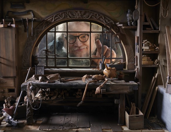 This image released by Netflix shows filmmaker Guillermo del Toro on the set of &quot;Guillermo del Toro's Pinocchio.&quot; (Netflix via AP)