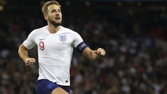 FILE - In this Thursday, Nov. 14, 2019 file photo, England&#039;s Harry Kane, right, celebrates scoring the fifth goal during the Euro 2020 group A qualifying soccer match between England and Monteneg ...