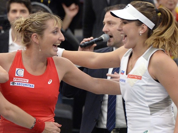 Swiss Team with Martina Hingis, Viktorija Golubic, Timea Bacsinszky and Belinda Bencic, from left, celebrates the victory against Germany during their World Group first round Fed Cup tennis match betw ...