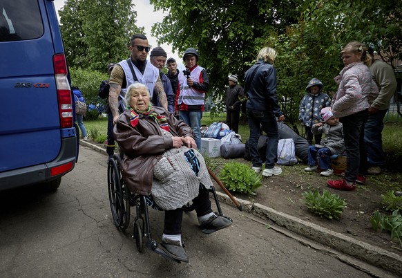 epa11342959 Ukrainian evacuees wait to register at the evacuation center which receives people who had to leave territories close to the Russian border in Kharkiv, Ukraine, 15 May 2024 amid the Russia ...