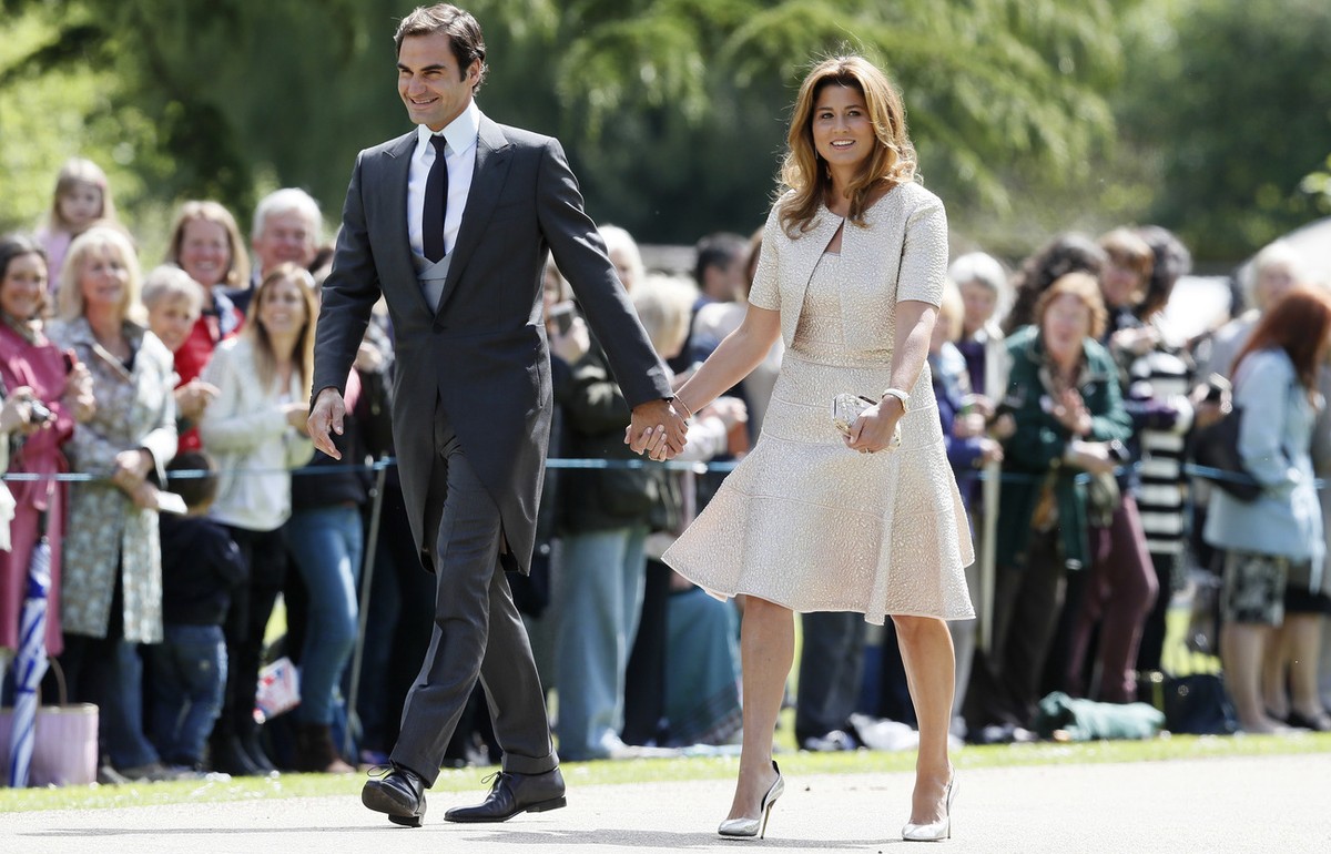 Swiss tennis player Roger Federer and his wife Mirka arrive at St Mark's Church in Englefield, England, ahead of the wedding of Pippa Middleton and James Matthews, Saturday, May 20, 2017. Middlet ...