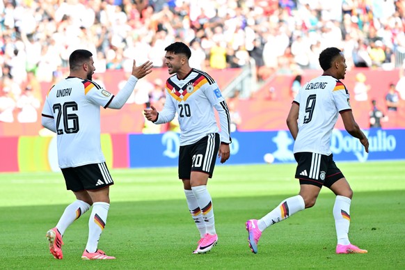 epa13052742 Deniz Undav of Germany (L) celebrates with his teamamtes after scoring the 1-1 goal during the FIFA World Cup 2026 group stage match Germany against Ivory Coast, in Toronto, Canada, 20 Jun ...