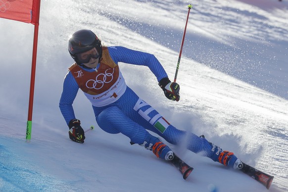 Manuela Moelgg, of Italy, attacks the gate during the first run of the Women's Giant Slalom at the 2018 Winter Olympics in Pyeongchang, South Korea, Thursday, Feb. 15, 2018., Thursday, Feb. 15, 2018. (AP Photo/Michael Probst)