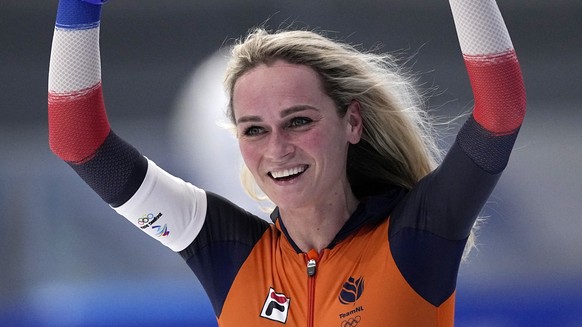Irene Schouten of the Netherlands reacts after winning the gold medal and setting an Olympic record in the women&#039;s speedskating 5,000-meter race at the 2022 Winter Olympics, Thursday, Feb. 10, 20 ...