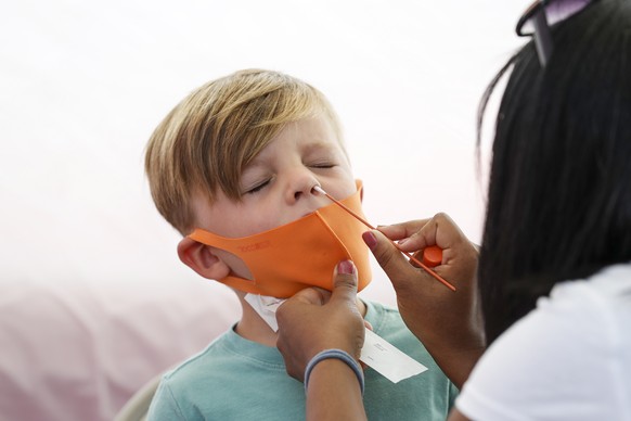 epa09426816 A nasal swab sample is collected from a child at a COVID-19 testing site in Los Angeles, California, USA, 23 August 2021. EPA/CAROLINE BREHMAN