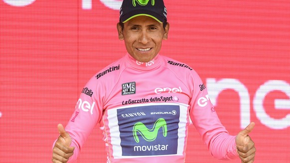 Colombian rider Nairo Quintana wears the pink jersey of the overall leader as he celebrates on the podium after completing the 19th stage of the Giro d&#039;Italia, Tour of Italy cycling race, from Sa ...