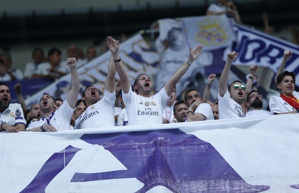 Real Madrid supporters chant prior to the start of a Spanish La Liga soccer match between Real Madrid and Barcelona, dubbed &#039;el clasico&#039;, at the Santiago Bernabeu stadium in Madrid, Spain, S ...