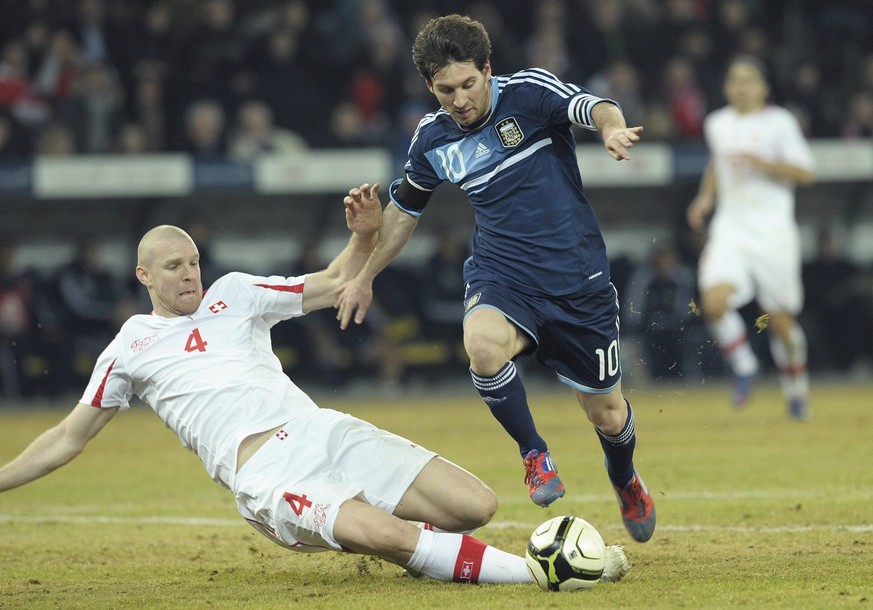 Argentina's Captain Lionel Messi, right, scores the second goal, next to Switzerland's Philippe Senderos, left, during a friendly soccer match between Switzerland and Argentina at the Stade ...