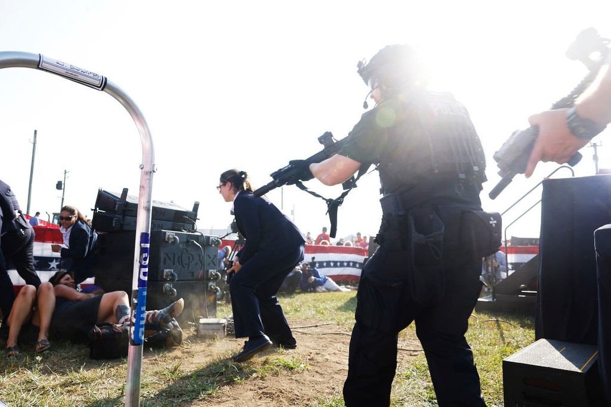 BUTLER, PENNSYLVANIA - JULY 13: Law enforcement react after shots were fire at republican presidential candidate former President Donald Trump's rally on July 13, 2024 in Butler, Pennsylvania. Bu ...