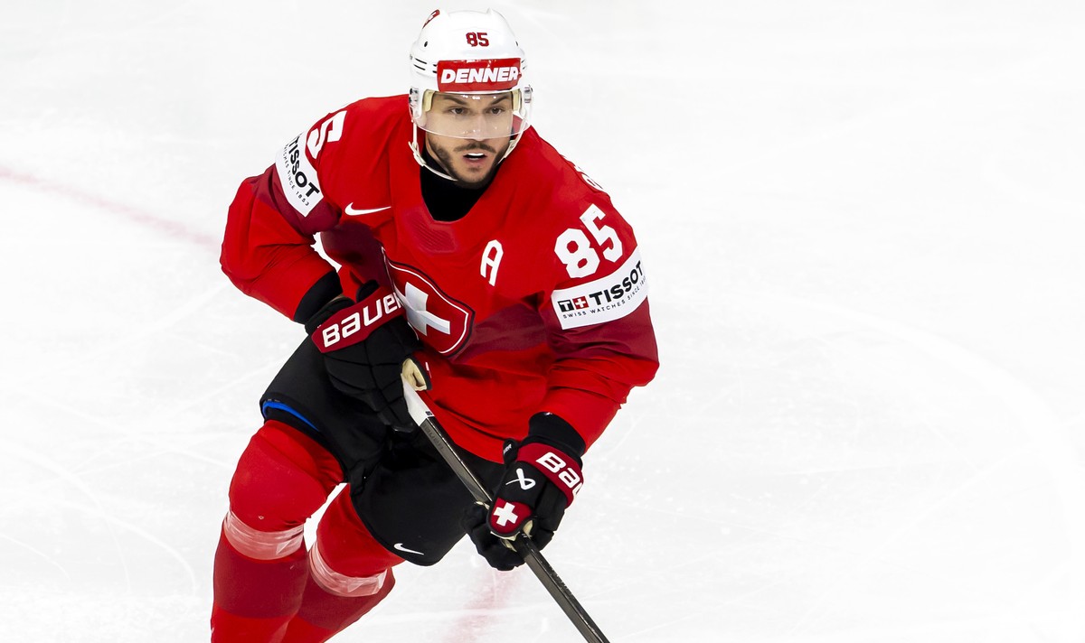 Switzerland's forward Sven Andrighetto controls the puck, during the IIHF 2025 World Championship semifinal game between Switzerland and Denmark, at the Avicii Arena (Globe), in Stockholm, Sweden ...