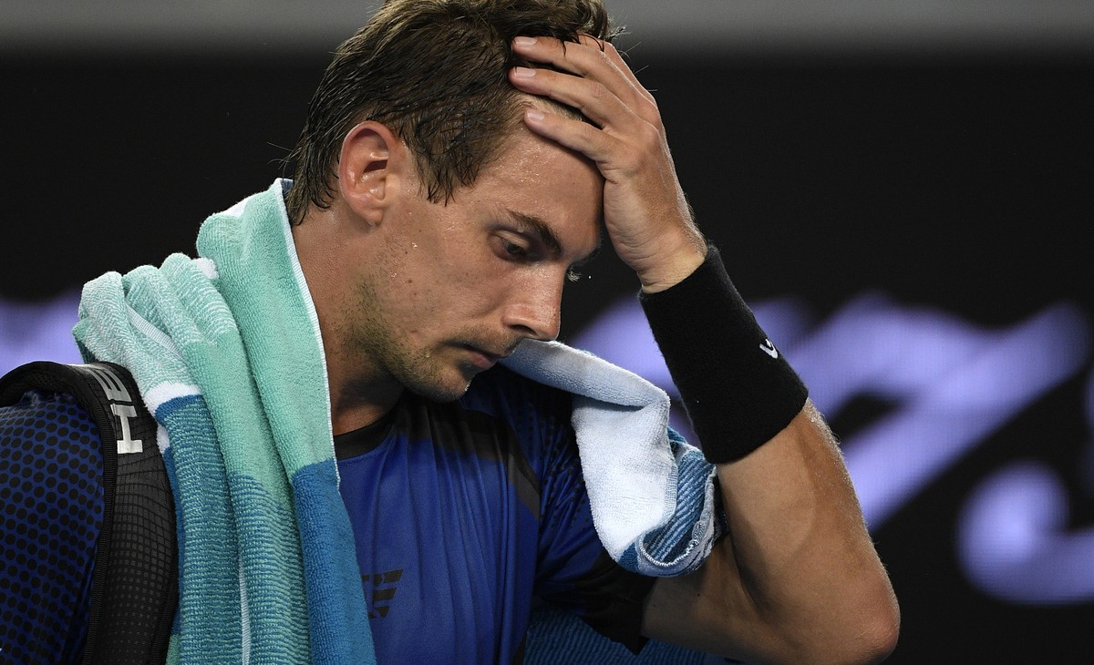 Switzerland's Henri Laaksonen leaves the court following his second round loss to Australia's Alex de Minaur at the Australian Open tennis championships in Melbourne, Australia, Wednesday, J ...
