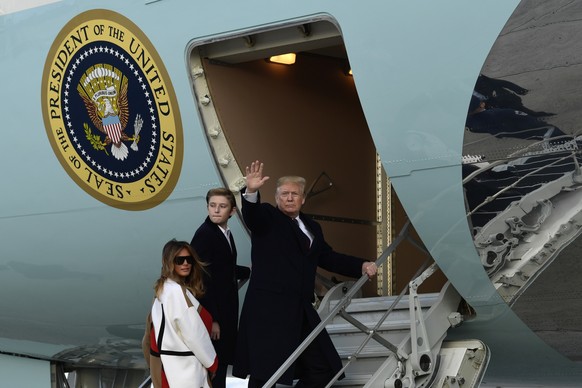 President Donald Trump, first lady Melania Trump and their son Barron Trump walk up the steps of Air Force One at Andrews Air Force Base in Md., Tuesday, Nov. 20, 2018. The Trumps are heading to Flori ...