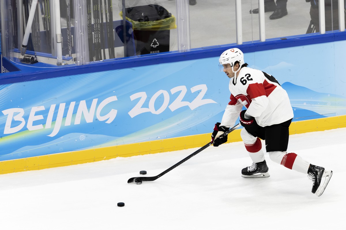 Switzerland's forward Denis Malgin controls the puck during the warm up prior the men's ice hockey preliminary round game between Czech Republic and Switzerland at the National Indoor Stadiu ...