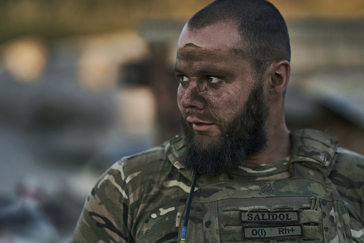 A Ukrainian soldier looks on at the front line near Bakhmut, one of the longest battles with Russian troops, Donetsk region, Ukraine, Monday, Aug. 14, 2023. (AP Photo/Libkos)