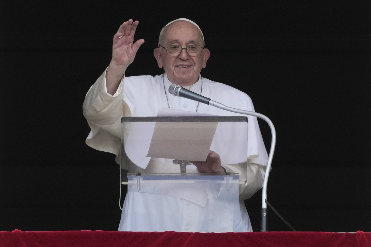 Pope Francis delivers his blessing as he recites the Angelus noon prayer from the window of his studio overlooking St.Peter's Square, at the Vatican, Sunday, Sept. 11, 2022. (AP Photo/Andrew Medi ...