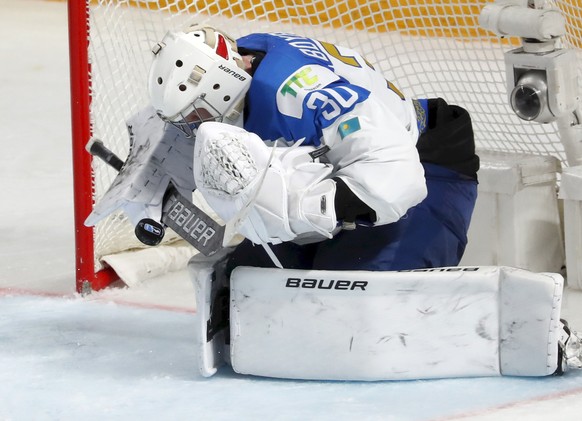 epa09222745 Goalkeeper Nikita Boyarkin of Kazkhstan in action during the IIHF Ice Hockey World Championship 2021 group B match between Kazakhstan and Finland at the Arena Riga, Latvia, 23 May 2021. EP ...