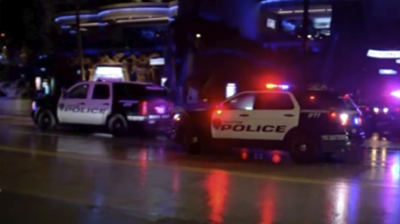 In this image made from video, police vehicles park outside the scene of a restaurant shooting Thursday, July 8, 2021, in Houston, Texas. Two men were killed and a woman was wounded in what Houston po ...