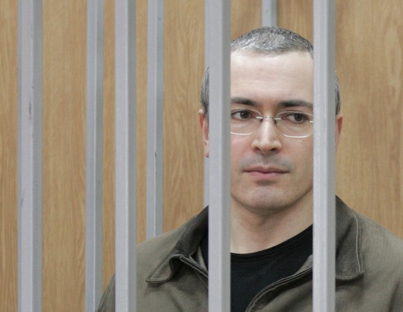 Mikhail Khodorkovsky, former CEO of the Yukos oil company seen in the defendants&#039; cage during a trial in a Moscow court, Friday, April 8, 2005. Defense lawyers for the oil tycoon who was once Rus ...