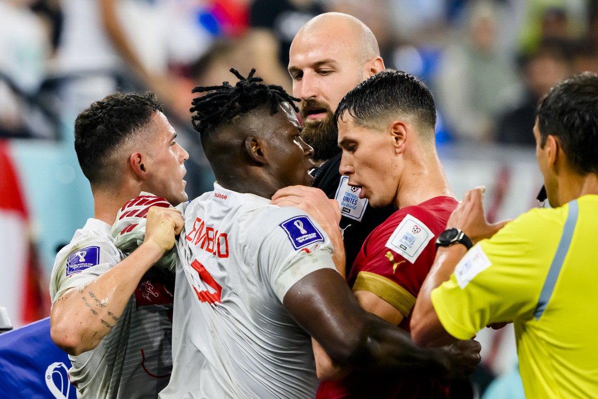 Switzerland's midfielder Granit Xhaka and Switzerland's forward Breel Embolo, talk with players of Serbia during the FIFA World Cup Qatar 2022 group G soccer match between Serbia and Switzer ...