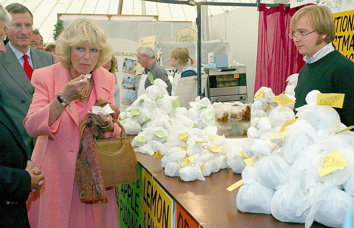 DEVON, ENGLAND - MAY 19: (NO UK SALES FOR 28 DAYS) HRH The Duchess of Cornwall samples some steam pudding during a visit to the Devon County Show, now in its 110th year, on May 19, 2005 in Devon, Engl ...