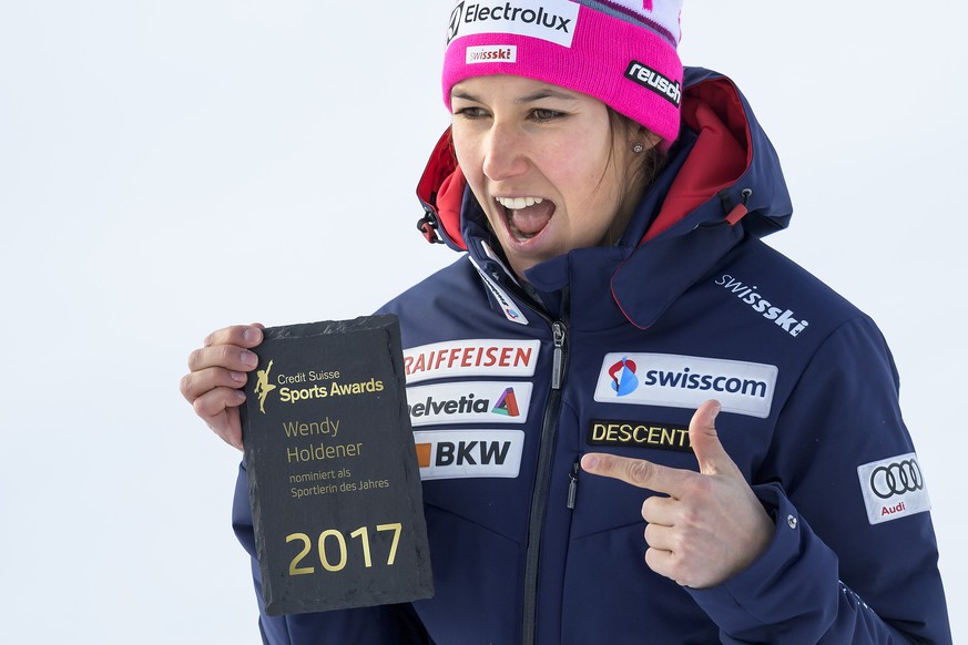 Wendy Holdener from Switzerland poses with a sign reading &quot;Nominated as the sportswoman of the year for Credit Suisse Sports Awards 2017&quot;, after the women&#039;s Super-G race at the FIS Alpi ...