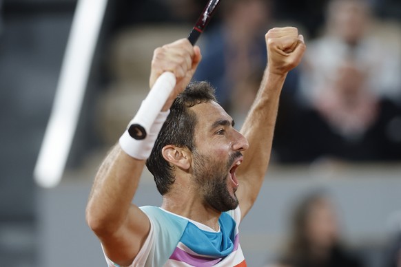 Croatia&#039;s Marin Cilic shouts after defeating Russia&#039;s Daniil Medvedev during their fourth round match of the French Open tennis tournament at the Roland Garros stadium Monday, May 30, 2022 i ...