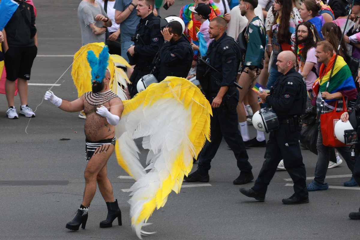 epa11499856 A participant wears wings during the 'CSD Berlin 2024' the 46th Christopher Street Day parade in Berlin, Germany, 27 July 2024. CSD is an annual European LGBTIQA* (lesbian, gay,  ...