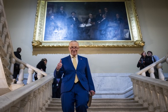 epa11150093 Democratic Senate Majority Leader Chuck Schumer walks to his office after speaking to reporters following the passage of the $95 billion foreign aid package for Ukraine, Israel and…