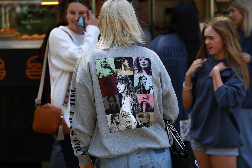 epa11153912 People line up to purchase &#039;Taylor Swift: The Eras Tour&#039; merchandise at the Melbourne Cricket Ground in Melbourne, Australia 15 February 2024. Last-minute tickets for all of Tayl ...