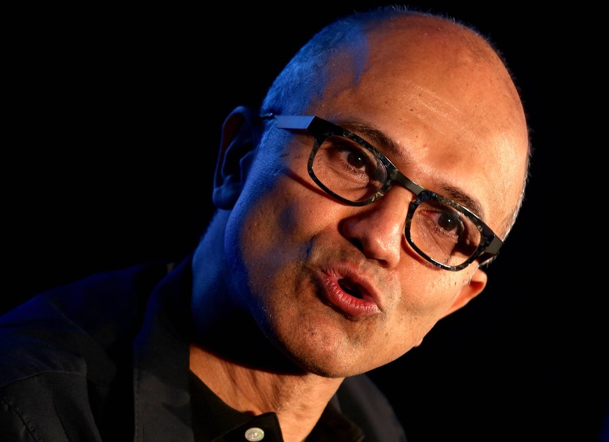 epa05804985 Microsoft Chief Executive Officer Satya Nadella reacts during an interactive session on Indian startups use of Microsoft Cloud for artificial intelligence, in Bangalore, India, 20 February ...