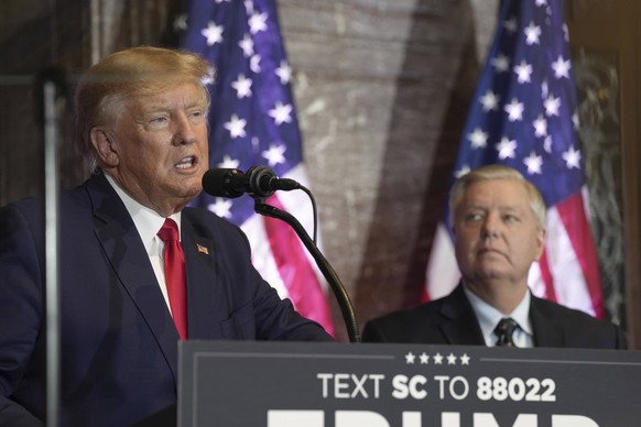 Former President Donald Trump, left, speaks at a campaign event as Sen. Lindsey Graham, R-S.C., looks on at the South Carolina Statehouse, Saturday, Jan. 28, 2023, in Columbia, S.C. (AP Photo/Meg Kinn ...