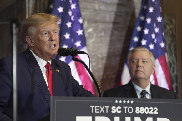 Former President Donald Trump, left, speaks at a campaign event as Senator Lindsey Graham, RS.C., looks on at the South Carolina Statehouse, Saturday, January 28, 2023, in Columbia, SC (AP Photo/Meg Kinn. ..