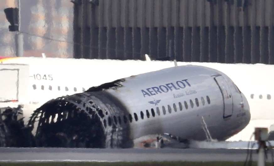 epa07550839 A Sukhoi Superjet 100 of the Russian airline Aeroflot sits on the tarmac after a fire that broke out while the plane crash landed at Sheremetyevo airport, in Moscow, Russia, 06 May 2019. C ...
