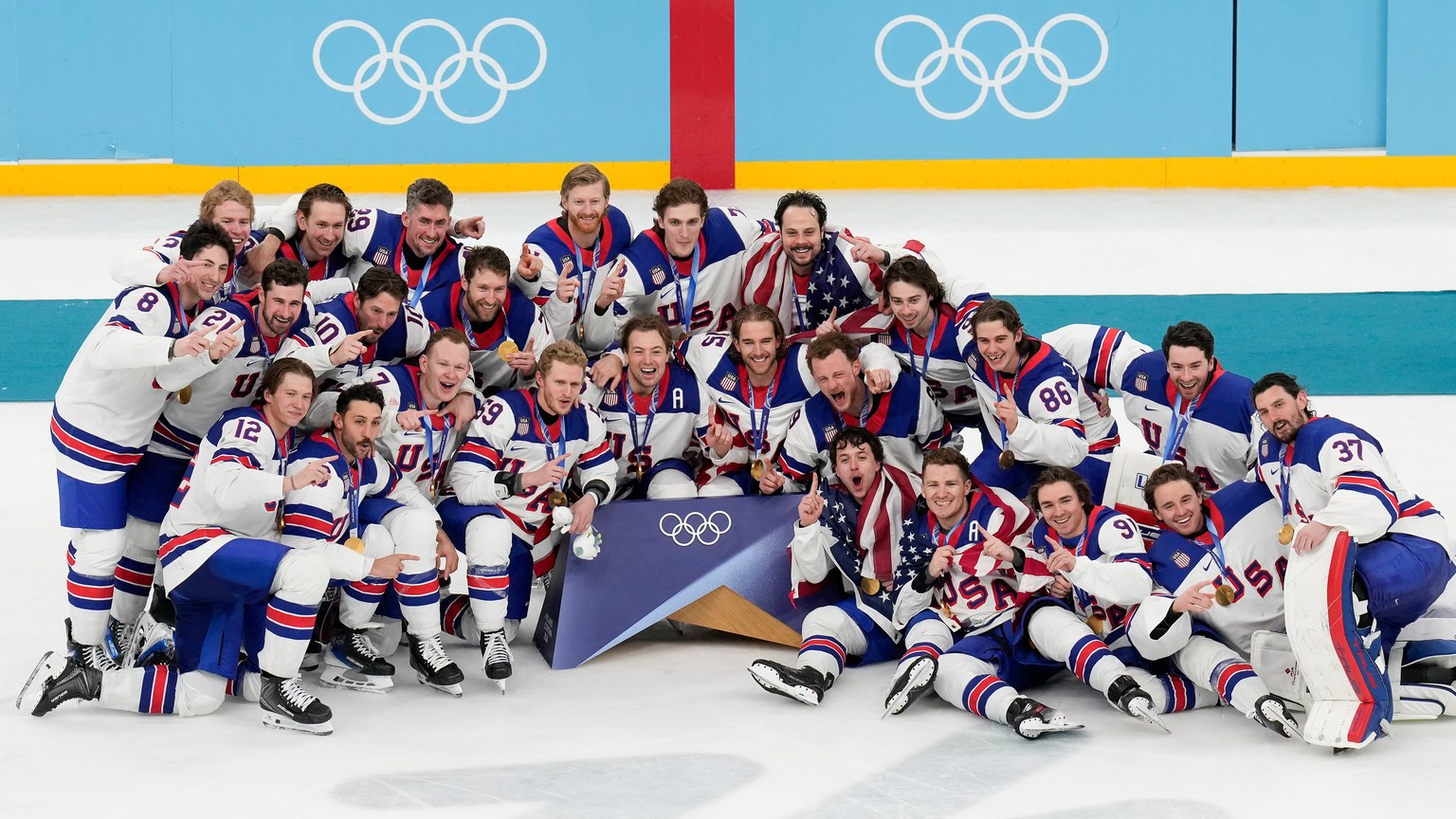 Team USA poses for a group photo after defeating Canada in the men's ice hockey gold medal game at the 2026 Winter Olympics, in Milan, Italy, Sunday, Feb. 22, 2026. (AP Photo/Luca Bruno)
Milan Co ...
