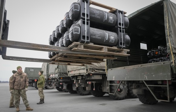 Ukrainian servicemen load Javelin anti-tank missiles, delivered as part of the United States of America&#039;s security assistance to Ukraine, into a military trucks at the Boryspil airport, outside K ...