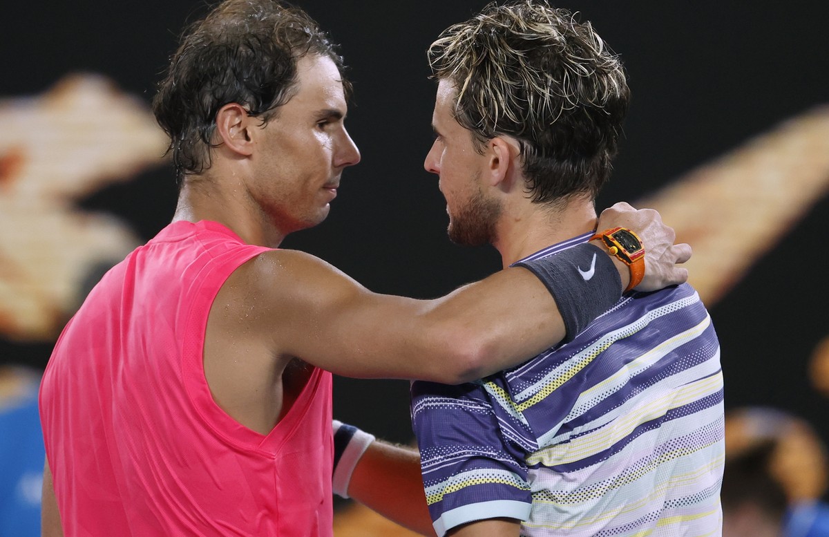 Austria's Dominic Thiem, right, is congratulated by Spain's Rafael Nadal after winning their quarterfinal match at the Australian Open tennis championship in Melbourne, Australia, Wednesday, ...