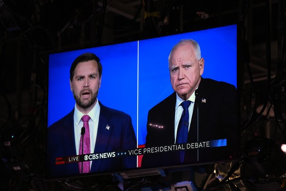 As seen on a monitor in the studio Republican vice presidential nominee Sen. JD Vance, R-Ohio, and Democratic vice presidential candidate Minnesota Gov. Tim Walz participate during a vice presidential ...