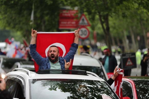epa10660466 Supporters of Turkish President Recep Tayyip Erdogan react after the early election result following the second round of the presidential elections, in Istanbul, Turkey, 28 May 2023. The s ...