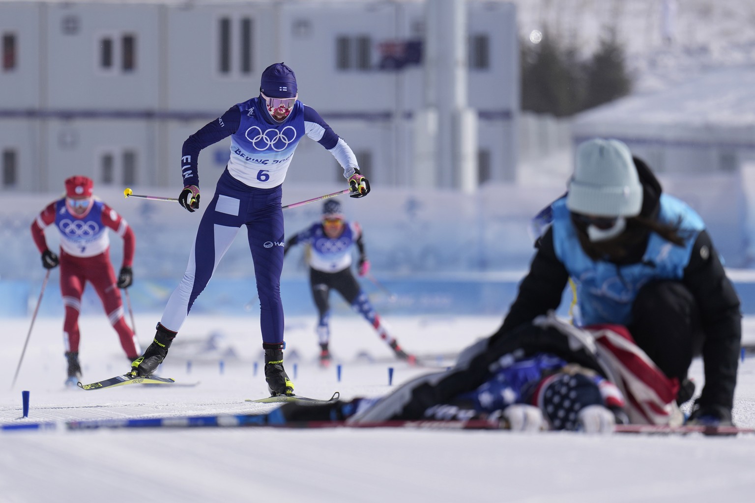 Finland's Kerttu Niskanen crosses the finish line after the women's 30km mass start free cross-country skiing competition at the 2022 Winter Olympics, Sunday, Feb. 20, 2022, in Zhangjiakou, ...
