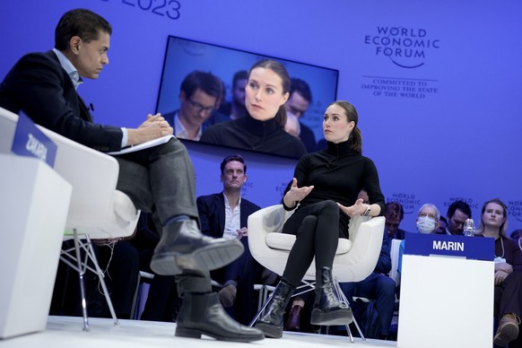 Finland's Prime Minister Sanna Marin, right, is interviewed by Fareed Zakaria at the World Economic Forum in Davos, Switzerland Tuesday, Jan. 17, 2023. The annual meeting of the World Economic Fo ...