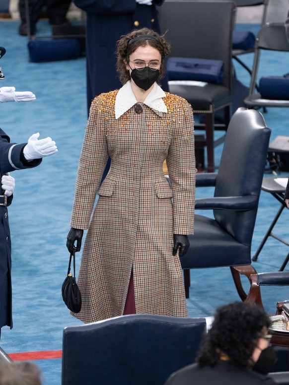 January 20, 2021, Washington, District of Columbia, USA: The children of First Gentleman Doug Emhoff, Cole Emhoff and Ella Emhoff, arrive onto the inaugural dias on January 20, 2021 as Joe Biden is in ...