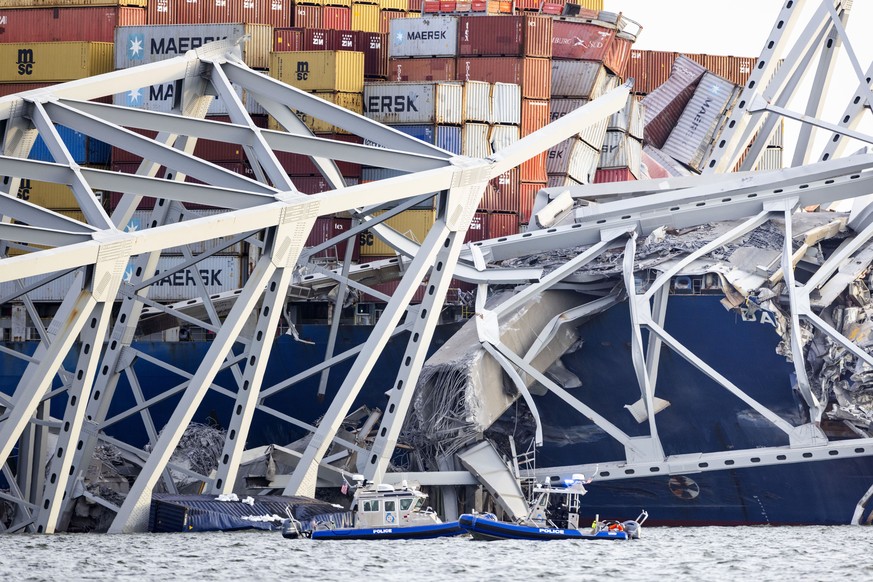 epa11244383 The Francis Scott Key Bridge rests partially collapsed after a cargo ship ran into it in Baltimore, Maryland, USA, 26 March 2024. The Maryland Department of Transportation confirmed that t ...