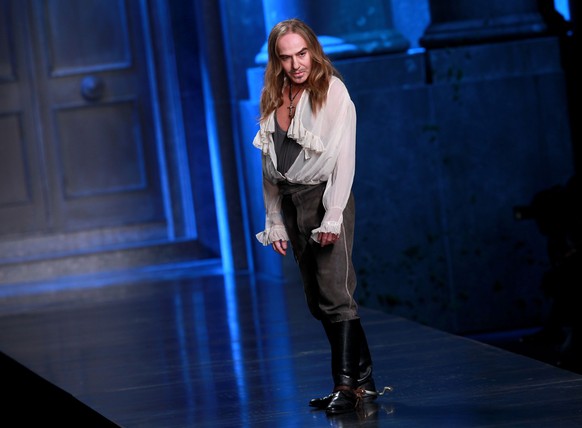 PARIS - MARCH 05: Designer John Galliano greets the audience during the Christian Dior Ready to Wear show as part of the Paris Womenswear Fashion Week Fall/Winter 2011 at Espace Ephemere Tuileries on  ...