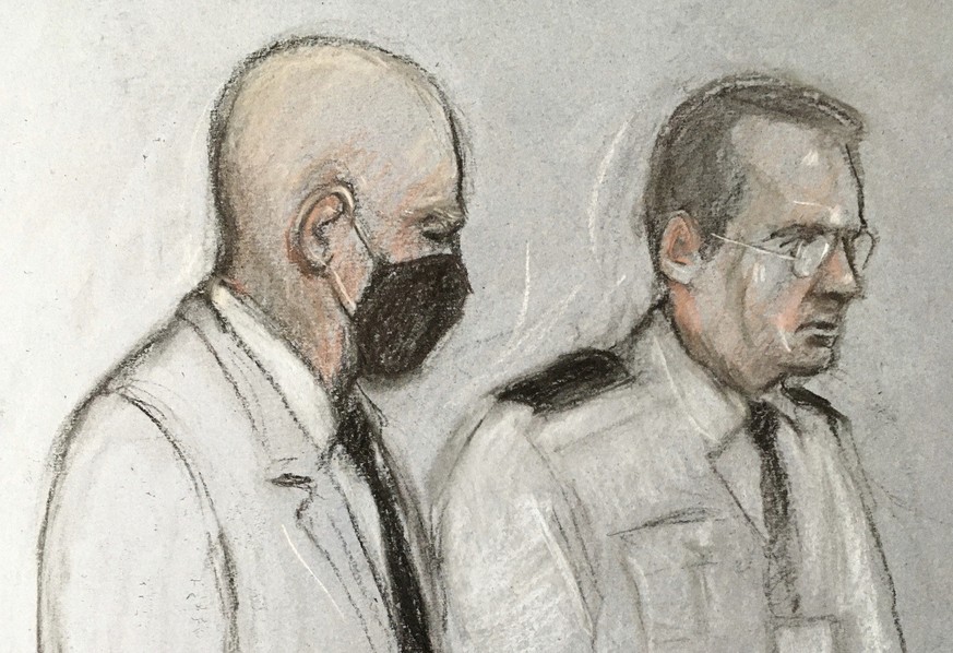 This court artist sketch by Elizabeth Cook shows former police officer Wayne Couzens at the Old Bailey in London, Thursday, Sept. 30, 2021. A serving London police officer has been sentenced to life i ...