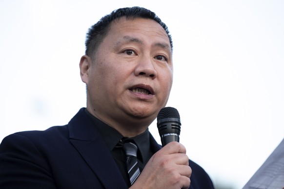 epa09994977 Activist and former student leader of the Tiananmen Square democracy movement Dan Wang speaks at a candlelight vigil and ceremony of remembrance to mark the 33rd anniversary of the 1989 Ti ...
