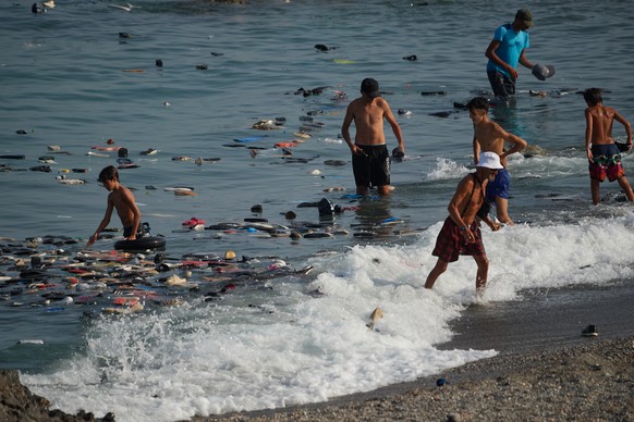 Belongings left behind by migrants float in the sea after they crossed from Morocco into the Spanish enclave of Ceuta, Thursday, July 30, 2026. (AP Photo/Antonio Sempere)
Spain Ceuta