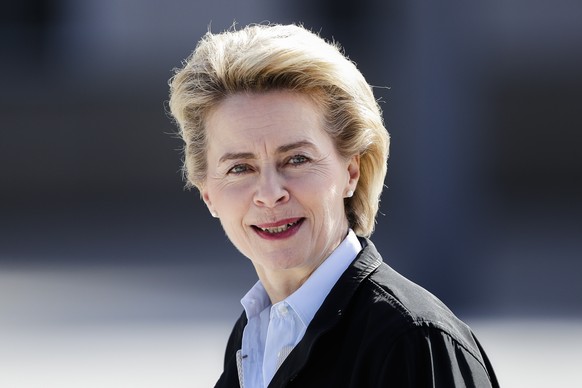 FILE - In this March 15, 2017 file German Defense Minister Ursula von der Leyen waits for her counterparts from Austria Hans Peter Doskozil and from Switzerland Guy Parmelian for talks at the Defense  ...